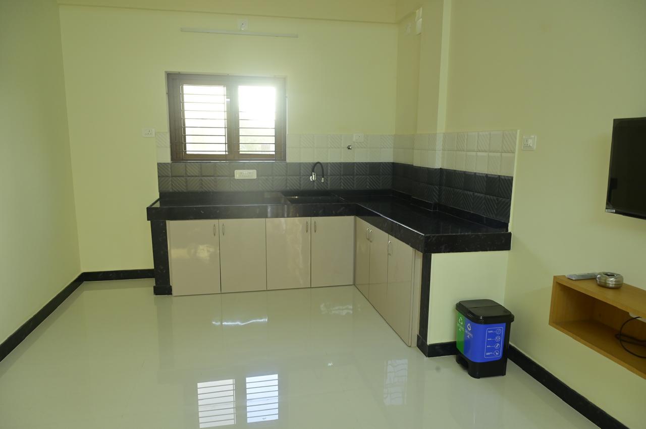 Attached Kitchenette with Granite Countertop at Malpe Manor